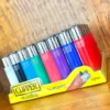 Clipper reusable lighter in a variety of colours on wood background