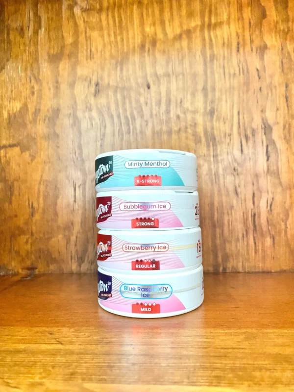 Kingston nicotine pouches in different nicotine strengths and a variety of flavours on wood background