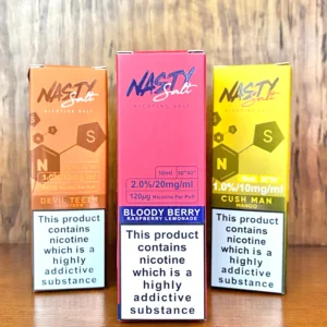 Nasty nicotine salts 10ml in 10mg and 20mg strengths and a variety of flavours on wood background