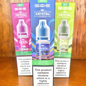 SKE Crystal nicotine salts 10ml in 10mg and 20mg strengths and a variety of flavours on wood background