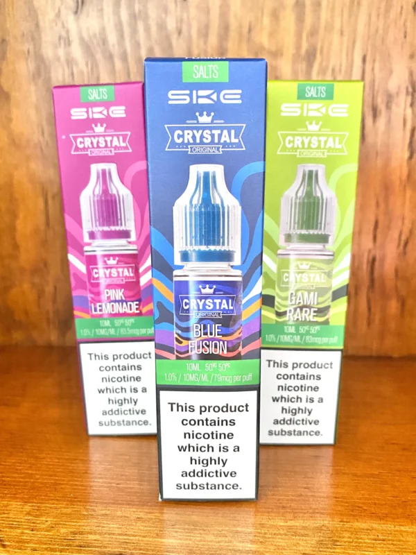 Ske-crystal-nicotine-salt-10ml SKE Crystal nicotine salts 10ml in 10mg and 20mg strengths and a variety of flavours on wood background
