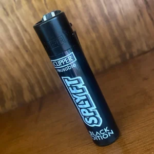 Clipper splyft reusable lighter in black on wood background