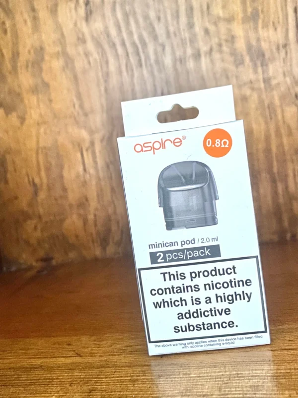 aspire Minican replacement pod 2 pack 0.8 ohms in white box on wood background