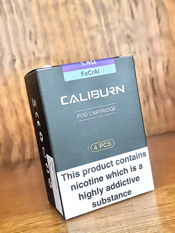 Uwell caliburn replacement pods 4 pack 1.4 ohm in black box on wood background