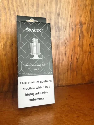 Smok nord 0.6 ohm 5 pack on wood background