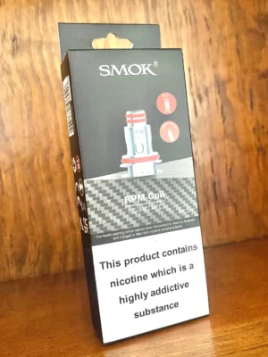 Smok rpm replacement coils 5 pack 0.8 ohm on wood background