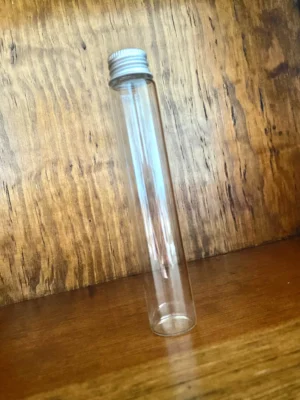 Empty glass container on wood background