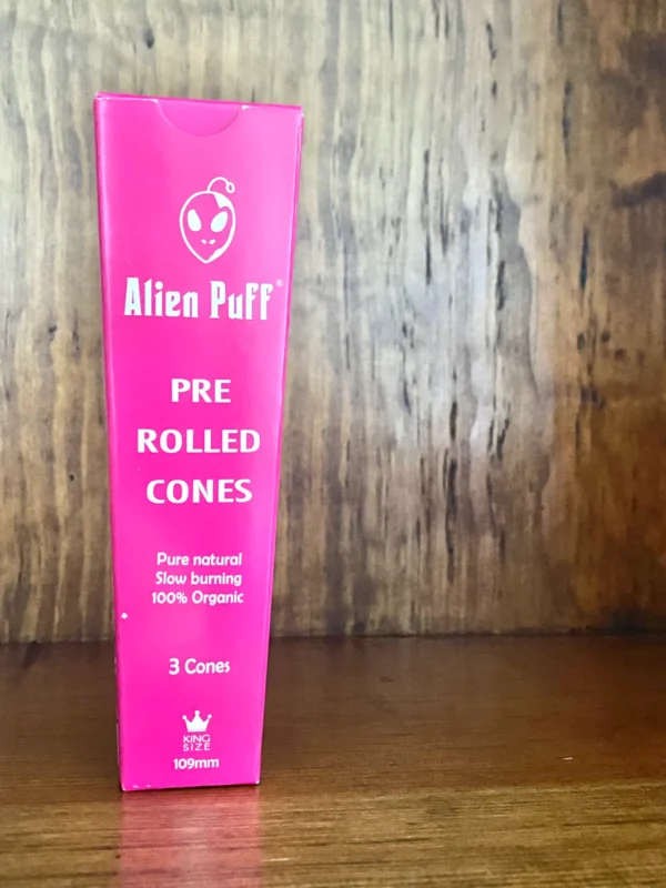 Alien puff pre rolled cones 3 pack in pink box on wood background