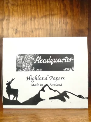 Highland rolling papers on wood background