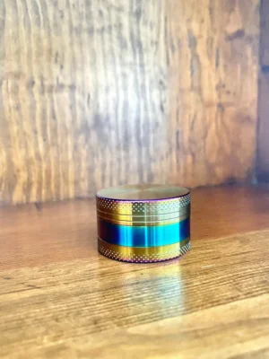 Metal rainbow grinder 2 part on wood background