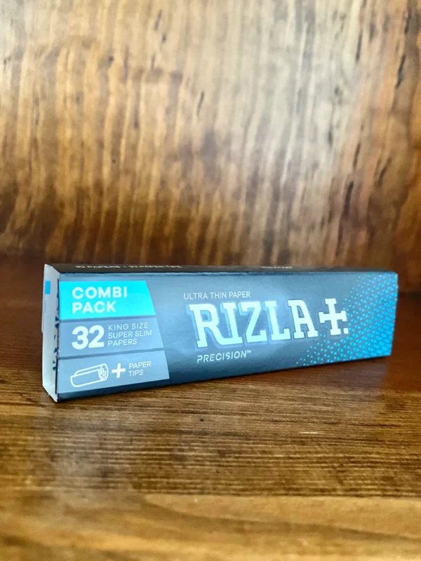 Rizla king size rolling papers with tips on wood background