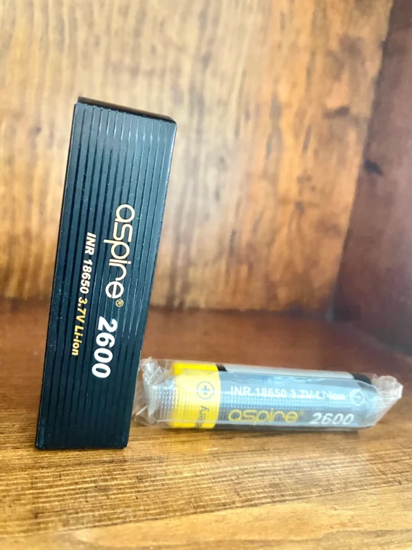 Aspire 2600 mah 18650 battery on wood background