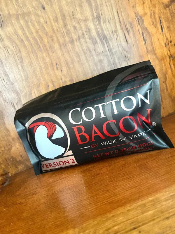 Cotton bacon Replacement cotton in bag on wood background